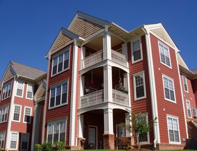 A large red and white apartment building named The South Terrace at Auburn.